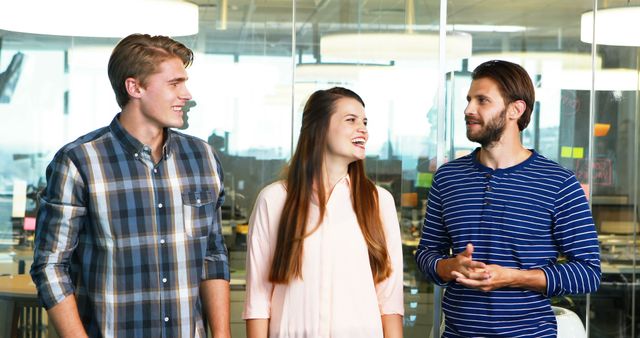 Young Professionals Having a Conversation in Modern Office - Download Free Stock Images Pikwizard.com