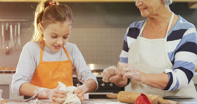 Grandmother and Granddaughter Making Dough in Kitchen - Download Free Stock Images Pikwizard.com