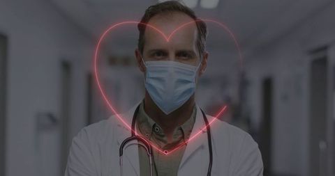Doctor Wearing Face Mask with Neon Heart Overlay in Hospital