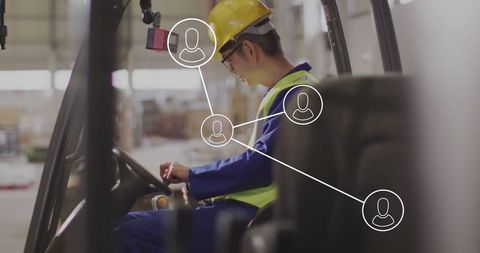 Asian Warehouse Worker with Digital Network Overlay