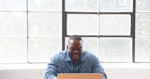 Happy Professional Celebrating Success at Office Desk