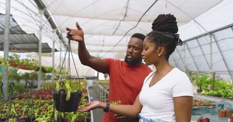Friends Exploring Horticulture in Greenhouse Environment