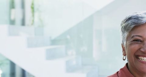 Cheerful Middle-Aged Woman Exuding Joy with Short Gray Hair