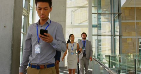 diverse business professionals walking through office corridor - Download Free Stock Images Pikwizard.com