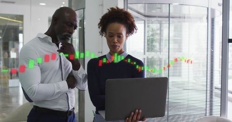 Diverse Business Professionals Analyzing Market Data Together