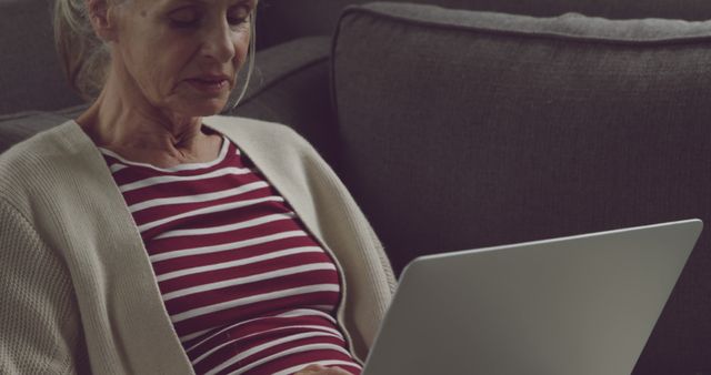 Senior Woman Using Laptop at Home in Casual Living Room - Download Free Stock Images Pikwizard.com