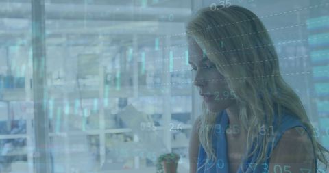 Caucasian Businesswoman Analyzing Data Metrics in Modern Office - Download Free Stock Images Pikwizard.com