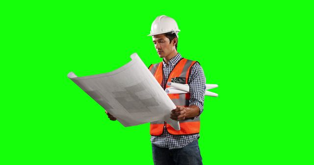 Construction Worker Analyzing Blueprints in Safety Gear - Download Free Stock Images Pikwizard.com