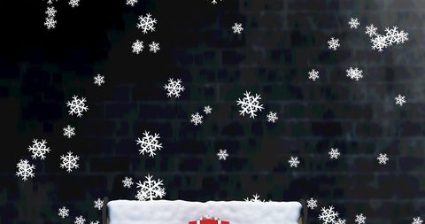 Christmas Gift on Bench with Snowflakes against Dark Background