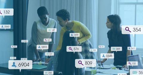 Diverse team collaborating around meeting table with floating data overlays and metrics