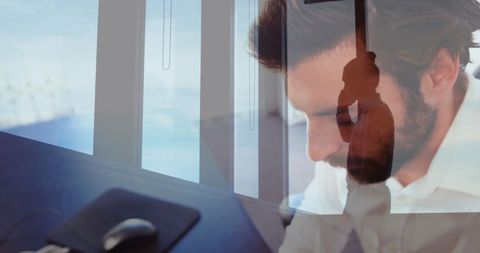 Professional man focusing on laptop work at office desk