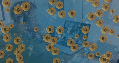 Man Using Laptop with Bitcoins Overlay, Tax Day and Celebration Concept