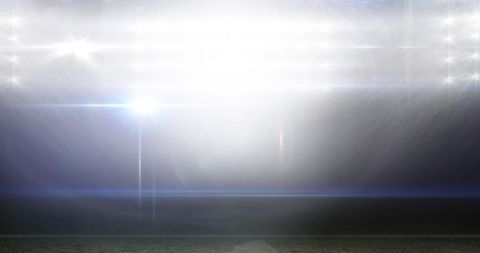 Floodlit stadium with blurred lights reflection concept