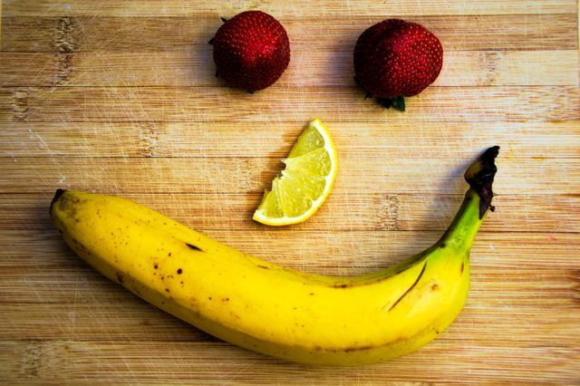 Creative Fruit Arrangement Idea with Strawberries, Banana, and Lemon - Download Free Stock Photos Pikwizard.com