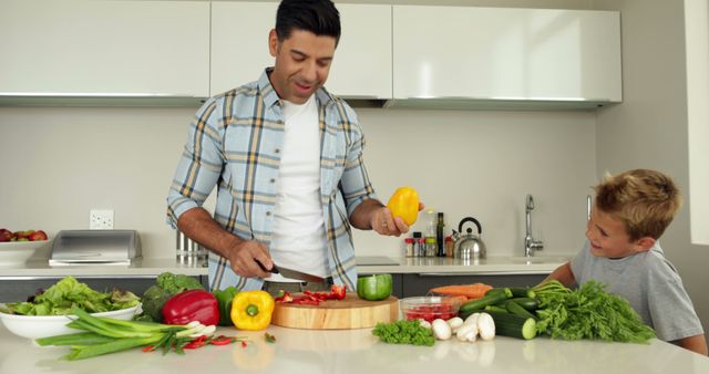 Father Teaching Son Cooking in Modern Kitchen with Fresh Vegetables - Download Free Stock Images Pikwizard.com