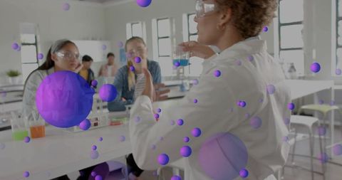 Stem instructor demonstrating chemistry experiment with augmented reality molecular overlay