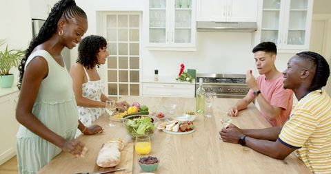 Friends Enjoy Culinary Bonding in Bright Modern Kitchen