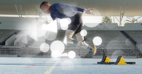 Teen Athlete Sprinting from Starting Blocks on Track