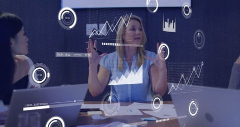 Business Team Analyzing Data with Futuristic Graphics Interface