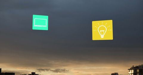 Cloud Computing Digital Icons in Sky over Urban Landscape