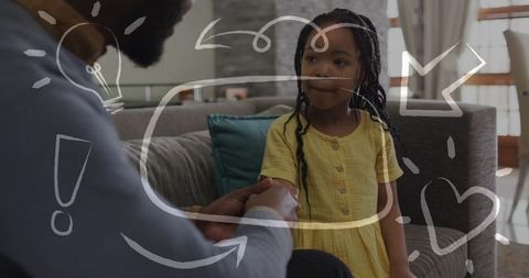 Father holding daughter hand, leaning in on couch, nurturing parenting bond, reassurance