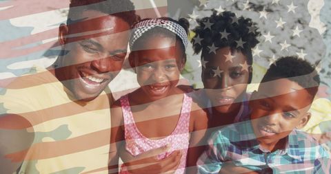 Happy Family Enjoying Patriotic Day at Beach with American Flag Overlay