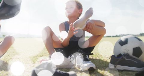 Boys Preparing for Outdoor Soccer on Sunny Day
