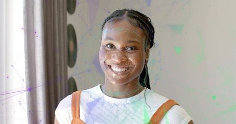 Smiling Young Woman in Casual Attire with Modern Background