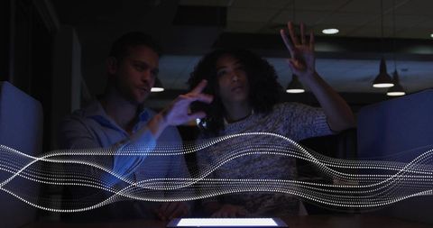 Innovative Team Collaboration with Digital Interface in Modern Office