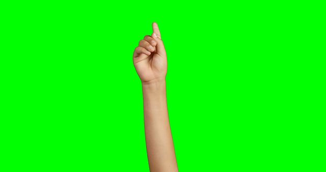 Close-up of person making hand gesture against green screen background
