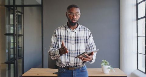 Business Professional Analyzing Data with Tablet in Modern Office