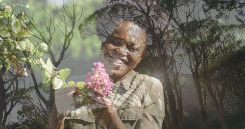 Double Exposure: Smiling Woman Holding Flowers in Woodland