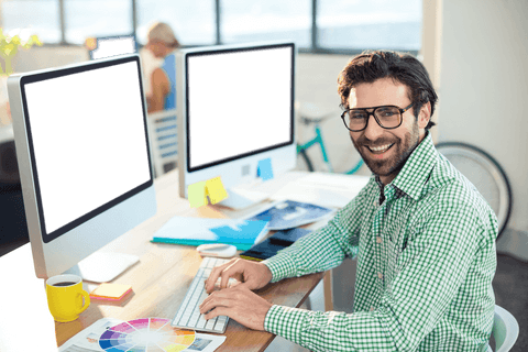 smiling graphic designer in modern office with transparent background - Download Free Stock Videos Pikwizard.com