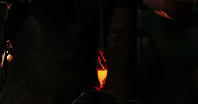 Blacksmith Forging Metal with Glowing Forge - Download Free Stock Images Pikwizard.com