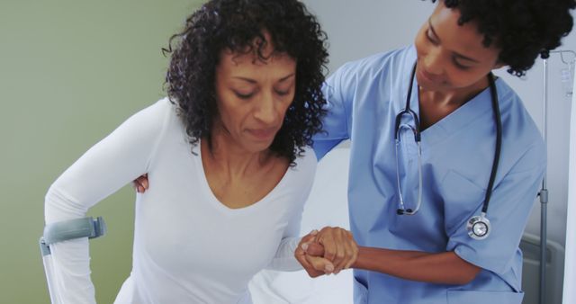 Nurse Assisting Patient with Crutches in Hospital Room - Download Free Stock Images Pikwizard.com