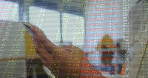 Commuter holding smartphone showing live stock market data overlay on train