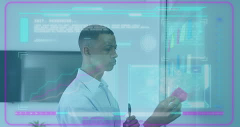 Businessman Analyzing Digital Data Interface in Modern Office