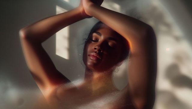 Serene Woman Behind Myst Glass in Soft Light