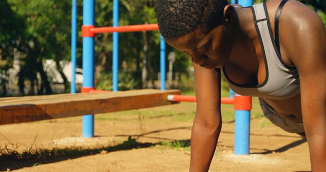 Woman Exercising at Outdoor Fitness Park - Download Free Stock Images Pikwizard.com