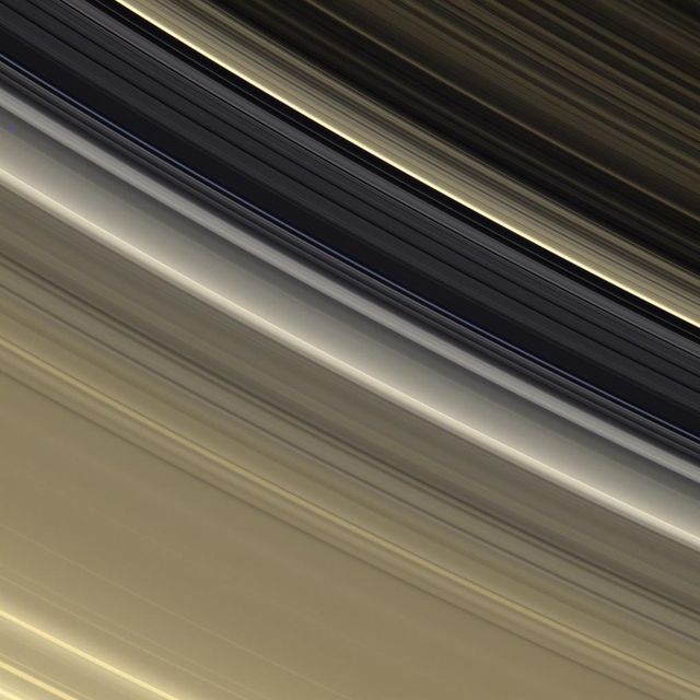 The rings are awash in subtle tones of gold and cream in this view which shows the outer B ring, the Cassini Division and the inner part of the A ring
