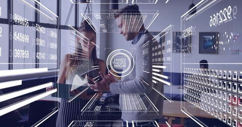 Business professionals collaborating with augmented reality analytics in open-plan office