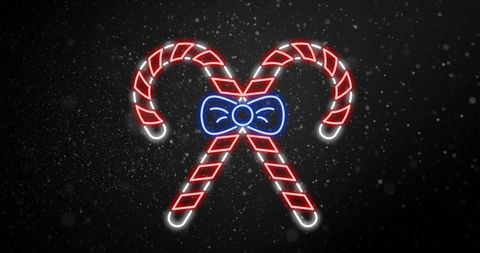 Neon candy canes with bow and falling snowflakes