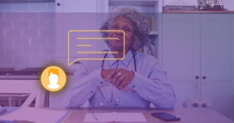 Senior medical professional consulting virtually from home kitchen