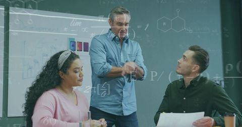 Man Leading Team Presentation in Conference Room with Mathematical Overlays