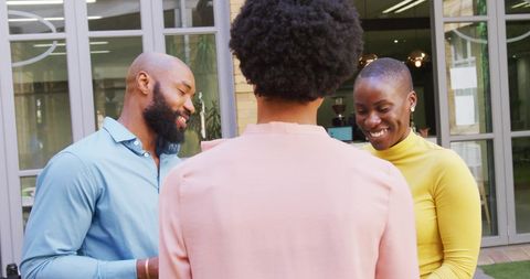 Casual office meeting with colleagues sharing laughter