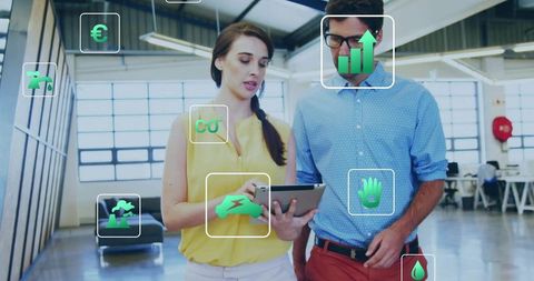Pointing woman and man discussing tablet with AR analytics overlays in open workspace