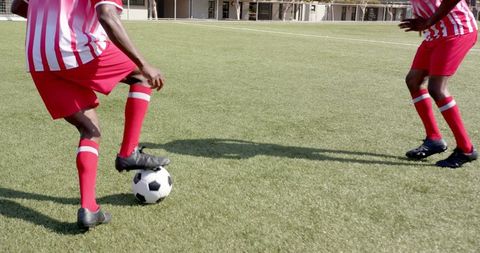Youth Soccer Players Dribbling on Bright Turf Field