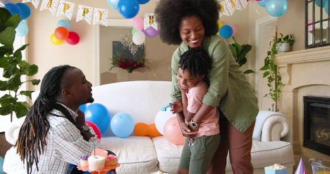Loving Family Celebrating Little Boy's Birthday at Home