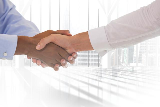Business professionals shaking hands representing partnership and successful collaboration in a modern office setting. Ideal for illustrating business agreements, team collaborations, networking opportunities, and successful negotiations in corporate environments. Can be used in websites, presentations, and marketing materials focusing on professional interaction and business diversity.
