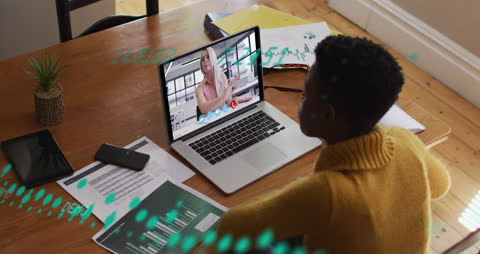 Businesswoman in Video Conference with Overlayed Financial Graphs